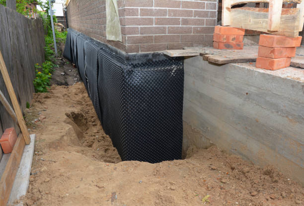 Happy homeowners after waterproofing job in Keego Harbor
